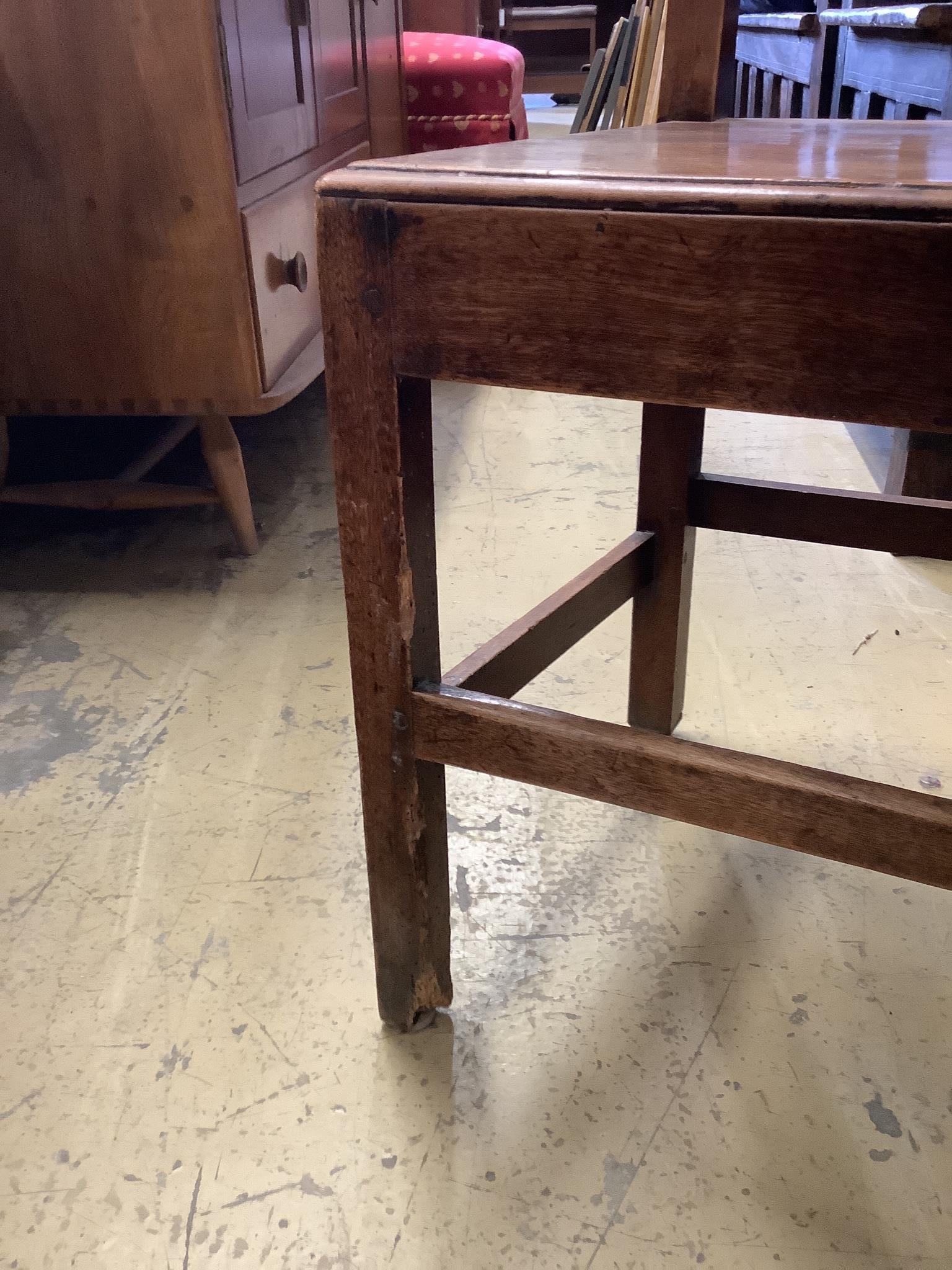 A set of six 19th century provincial fruitwood solid seat dining chairs, one with arms.